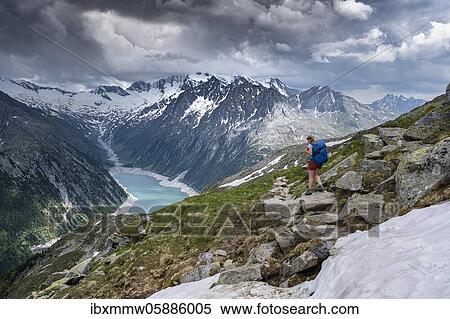 Hiking on the Berlin High Altitude Trail, Schlegeis Reservoir, Schlegeis reservoir, Zillertal Alps, Schlegeiskees Glacier, Zillertal, Tyrol, Austria, Europe View Large Photo Image Stock Photography - Hiking on the Berlin High Altitude Trail, Schlegeis Reservoir, Schlegeis reservoir, Zillertal Alps, Schlegeiskees Glacier, Zillertal, Tyrol, Austria, Europe. Fotosearch