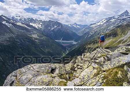 Hiking on the Berlin High Altitude Trail, Schlegeis Reservoir, Schlegeis reservoir, Zillertal Alps, Schlegeiskees Glacier, Zillertal, Tyrol, Austria, Europe View Large Photo Image Stock Photography - Hiking on the Berlin High Altitude Trail, Schlegeis Reservoir, Schlegeis reservoir, Zillertal Alps, Schlegeiskees Glacier, Zillertal, Tyrol, Austria, Europe. Fotosearch