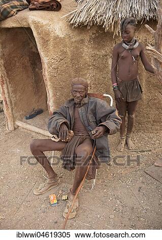 Himbahäuptling and Himbamädchen in front of the clay hut, Kaokoveld, Namibia, Africa View Large Photo Image Stock Photography - Himbahäuptling and Himbamädchen in front of the clay hut, Kaokoveld, Namibia, Africa. Fotosearch