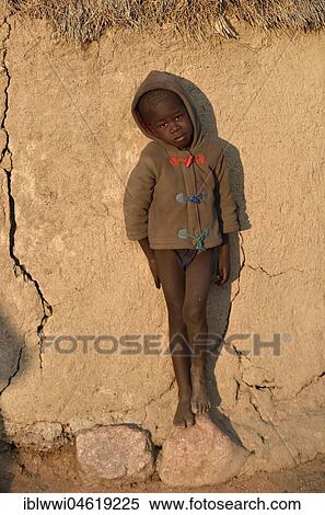 Himbajunge leans on mud hut, Kunene, Kaokoveld, Namibia, Africa View Large Photo Image Stock Photography - Himbajunge leans on mud hut, Kunene, Kaokoveld, Namibia, Africa. Fotosearch