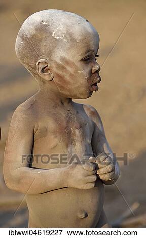 Stock Photo - Himbajunge rubbed with ash, Portrait, Kunene, Kaokoveld, Namibia, Africa. Fotosearch