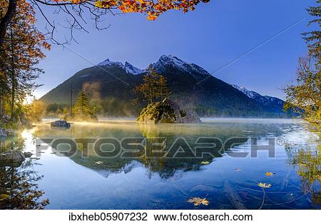 Hintersee with morning fog at sunrise, water reflection, behind Hochkalter, Berchtesgaden National Park, Ramsau, Upper Bavaria, Bavaria, Germany, Europe View Large Photo Image Stock Image - Hintersee with morning fog at sunrise, water reflection, behind Hochkalter, Berchtesgaden National Park, Ramsau, Upper Bavaria, Bavaria, Germany, Europe. Fotosearch