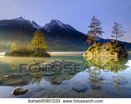 Hintersee with morning fog at sunrise, behind Hochkalter, Berchtesgaden National Park, Ramsau, Upper Bavaria, Bavaria, Germany, Europe View Large Photo Image Stock Image - Hintersee with morning fog at sunrise, behind Hochkalter, Berchtesgaden National Park, Ramsau, Upper Bavaria, Bavaria, Germany, Europe. Fotosearch