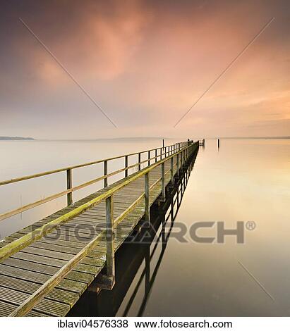 Stock Photo - Holzsteg, at Morgenrot, Plauer See, Plau am See, Mecklenburg-Western Pomerania, Germany, Europe. Fotosearch