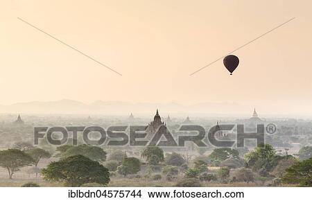 Picture - Hot air balloon over Bagan temples at sunrise, Bagan, Division Mandalay, Myanmar, Asia. Fotosearch