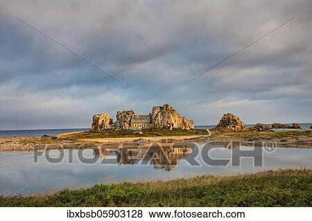 House between granite rocks with water reflection, Plougrescant, Brittany, France, Europe View Large Photo Image Stock Photo - House between granite rocks with water reflection, Plougrescant, Brittany, France, Europe. Fotosearch