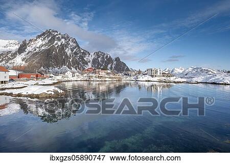 Stock Photo - Houses by a quiet fjord, behind rough rock walls and high mountains, Svolvaer, Nordland, Lofoten, Norway, Europe. Fotosearch