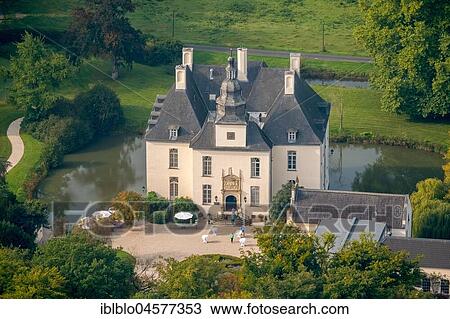 Stock Image - Hünxe, Castle Hotel Gartrop, Blumraths Restaurant, Schloss Gartrop, water castle, Hünxe, Ruhr Area, Lower Rhine, Germany, Europe. Fotosearch