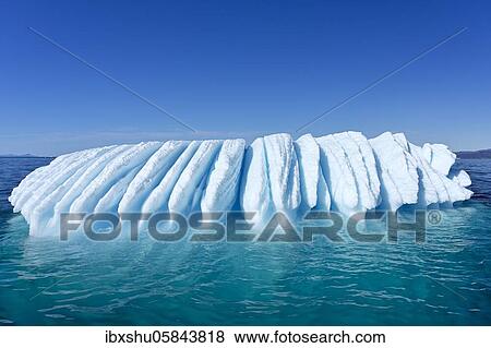 Stock Photo - Iceberg drifts through Icefjord, UNESCO World Heritage Site, Disko Bay, Ilulissat, West Greenland, Greenland, North America. Fotosearch