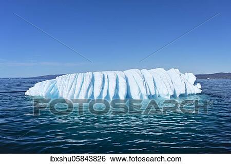 Stock Photograph - Iceberg drifts through Icefjord, UNESCO World Heritage Site, Disko Bay, Ilulissat, West Greenland, Greenland, North America. Fotosearch