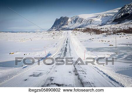 Iced snow road, in winter landscape, behind mountain range and sea, Nordland, Lofoten, Norway, Europe View Large Photo Image Stock Image - Iced snow road, in winter landscape, behind mountain range and sea, Nordland, Lofoten, Norway, Europe. Fotosearch