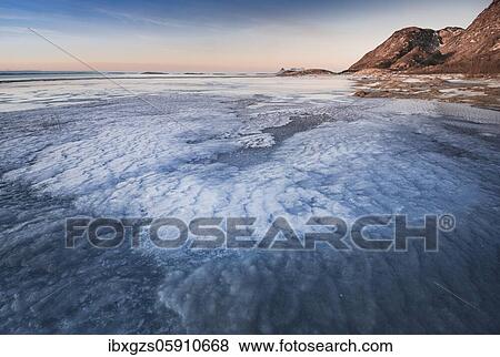 Stock Photo - Icy sandy beach, Langsanden Strand, Nordland, Norway, Europe. Fotosearch