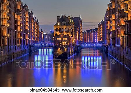 Illuminated "Wasserschloss" between Holländischerbrookfleet and Wandrahmsfleet in the Speicherstadt, evening twilight, Hamburg, Germany, Europe View Large Photo Image Stock Photography - Illuminated "Wasserschloss" between Holländischerbrookfleet and Wandrahmsfleet in the Speicherstadt, evening twilight, Hamburg, Germany, Europe. Fotosearch