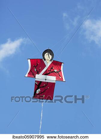 Kite in the shape of a woman, Japanese woman in red kimono, flying in front of a blue sky, North Rhine-Westphalia, Germany, Europe View Large Photo Image Stock Photography - Kite in the shape of a woman, Japanese woman in red kimono, flying in front of a blue sky, North Rhine-Westphalia, Germany, Europe. Fotosearch