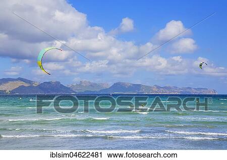 Kitesurfing on sea waves, Alcudia beach, Mallorca, Balearic Islands, Spain, Europe View Large Photo Image Stock Image - Kitesurfing on sea waves, Alcudia beach, Mallorca, Balearic Islands, Spain, Europe. Fotosearch