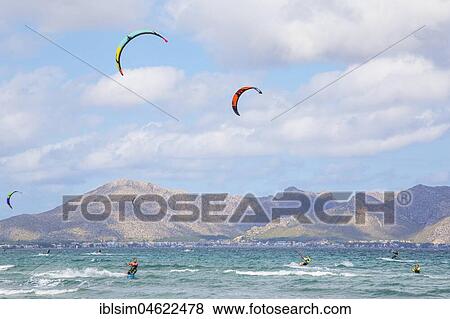 Kitesurfing on sea waves, Alcudia beach, Mallorca, Balearic Islands, Spain, Europe View Large Photo Image Stock Photo - Kitesurfing on sea waves, Alcudia beach, Mallorca, Balearic Islands, Spain, Europe. Fotosearch