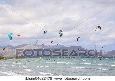 Kitesurfing on sea waves, Alcudia beach, Mallorca, Balearic Islands, Spain, Europe View Large Photo Image Stock Photo - Kitesurfing on sea waves, Alcudia beach, Mallorca, Balearic Islands, Spain, Europe. Fotosearch