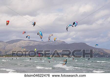 Kitesurfing on sea waves, Alcudia beach, Mallorca, Balearic Islands, Spain, Europe View Large Photo Image Stock Photograph - Kitesurfing on sea waves, Alcudia beach, Mallorca, Balearic Islands, Spain, Europe. Fotosearch
