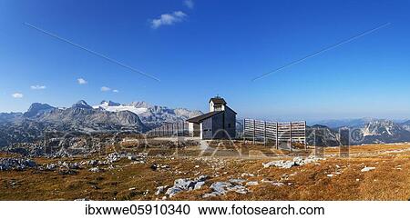 Stock Image - Krippenstein Chapel with a view of the Hoher Dachstein, Dachstein massif, Krippenstein, Obertraun, Salzkammergut, Upper Austria, Austria, Europe. Fotosearch
