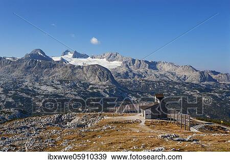 Krippenstein Chapel with a view of the Hoher Dachstein, Dachstein massif, Krippenstein, Obertraun, Salzkammergut, Upper Austria, Austria, Europe View Large Photo Image Stock Photo - Krippenstein Chapel with a view of the Hoher Dachstein, Dachstein massif, Krippenstein, Obertraun, Salzkammergut, Upper Austria, Austria, Europe. Fotosearch