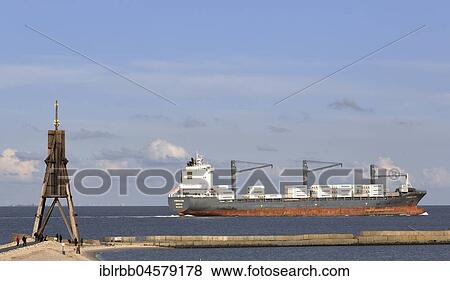 Kugelbake with freighter on the Elbe, mouth of the Elbe into the North Sea, emblem of the city of Cuxhaven, Lower Saxony, Germany, Europe View Large Photo Image Stock Photo - Kugelbake with freighter on the Elbe, mouth of the Elbe into the North Sea, emblem of the city of Cuxhaven, Lower Saxony, Germany, Europe. Fotosearch
