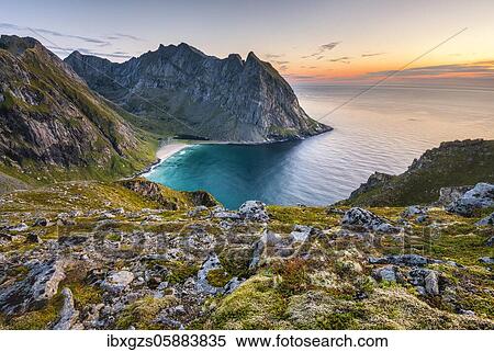 Kvalvika beach between the Lofoten mountains, back wide sea, Ryten peaks, Fredvang, Lofoten, Nordland, Norway, Europe View Large Photo Image Stock Photography - Kvalvika beach between the Lofoten mountains, back wide sea, Ryten peaks, Fredvang, Lofoten, Nordland, Norway, Europe. Fotosearch
