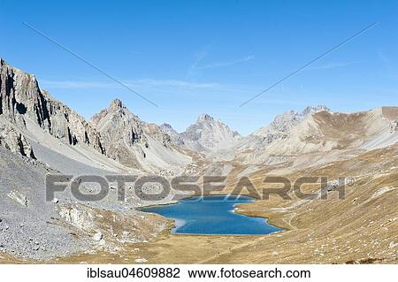 Lac de l' Oronaye mountain lake in a barren mountain landscape, near Larche, Commune nouvelle Val d' Oronaye, Département Alpes-de-Haute-Provence, France, Europe View Large Photo Image Stock Image - Lac de l' Oronaye mountain lake in a barren mountain landscape, near Larche, Commune nouvelle Val d' Oronaye, Département Alpes-de-Haute-Provence, France, Europe. Fotosearch