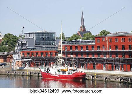 Stock Photo - Lightship Fehmarnbelt at the Hansa harbour with Mediadocks, Lübeck, Schleswig-Holstein, Germany, Europe. Fotosearch