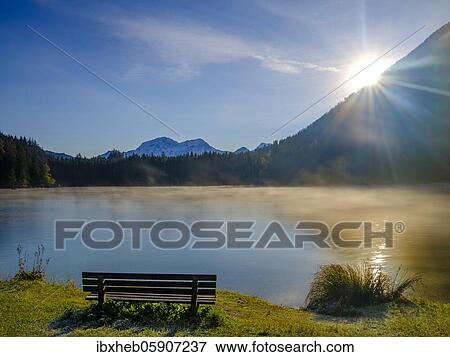 Lonely bench at Hintersee, in the back Hoher Göll, Berchtesgaden National Park, Ramsau, Upper Bavaria, Bavaria, Germany, Europe View Large Photo Image Stock Photo - Lonely bench at Hintersee, in the back Hoher Göll, Berchtesgaden National Park, Ramsau, Upper Bavaria, Bavaria, Germany, Europe. Fotosearch