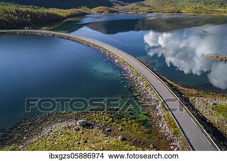 Picture - Lonely country road crossing a fjord, Lødingen, Nordland, Lofoten, Norway, Europe. Fotosearch