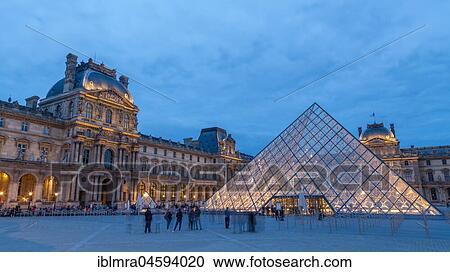 Stock Image - Louvre with glass pyramid at dusk, Paris, France, Europe. Fotosearch