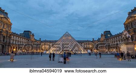 Stock Photo - Louvre with glass pyramid at dusk, Paris, France, Europe. Fotosearch