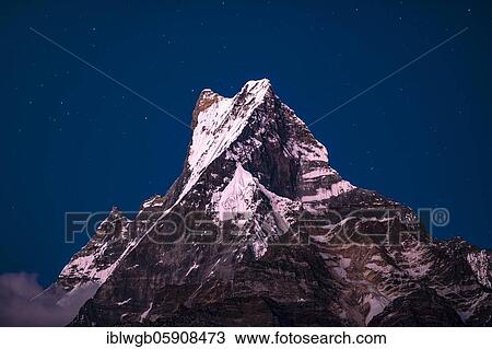 Stock Image - Machapuchare by night sky, Himalaya, fish tail, 6997m, holy mountain, Mardi Himal, Annapurna region, Nepal, Asia. Fotosearch