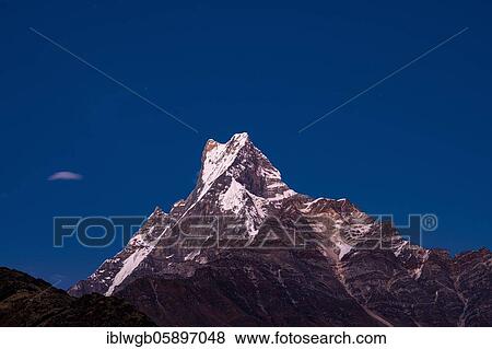 Stock Photo - Machapuchare in the evening light, Himalaya, fish tail, 6997m, holy mountain, Mardi Himal, Annapurna region, Nepal, Asia. Fotosearch
