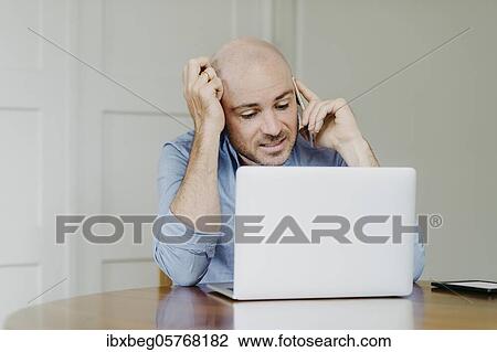 Stock Image - Man at home office. Fotosearch
