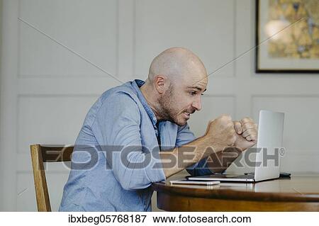 Stock Photo - Man at home office. Fotosearch