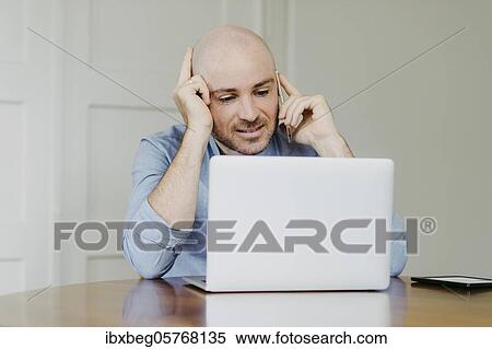 Man at home office View Large Photo Image Stock Photography - Man at home office. Fotosearch