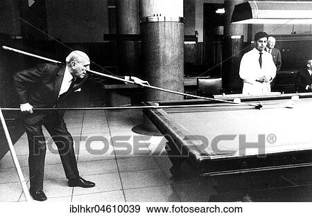 Stock Photo - Man playing with long cue billiard, Mexico City, Mexico, Central America. Fotosearch