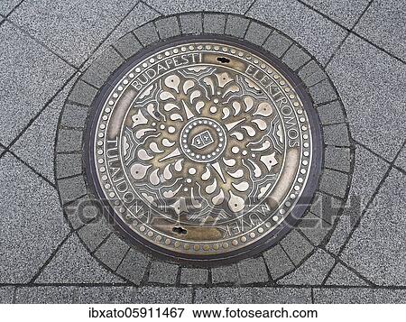 Stock Photo - Manhole cover, Budapest, Hungary, Europe. Fotosearch