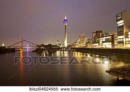 Stock Photography - Media harbour with Rhine tower and Gehry buildings at dawn, Düsseldorf, North Rhine-Westphalia, Germany, Europe. Fotosearch