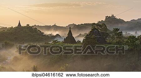 Mist over hills and stupas of Mrauk U at sunrise, Burma, Myanmar, Asia View Large Photo Image Stock Image - Mist over hills and stupas of Mrauk U at sunrise, Burma, Myanmar, Asia. Fotosearch