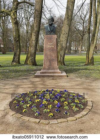 Stock Image - Monument to the writer Theodor Storm, bust by sculptor Adolf Brütt, Husum Castle Park, Husum, North Frisia, Schleswig-Holstein, Germany, Europe. Fotosearch