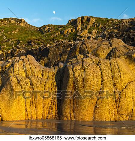 Stock Photography - Moon above the rocky coast at Porth Nanven, St. Just, Cornwall, England, Great Britain. Fotosearch