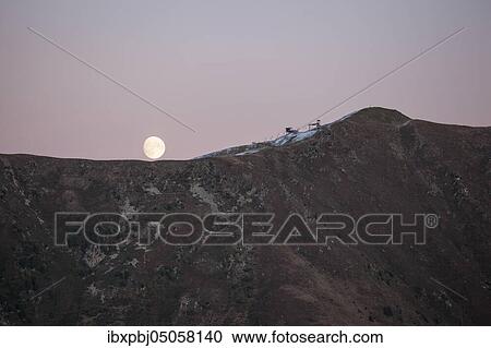 Stock Image - Moonrise, Ski area Axamer Lizum, Tyrol, Austria, Europe. Fotosearch