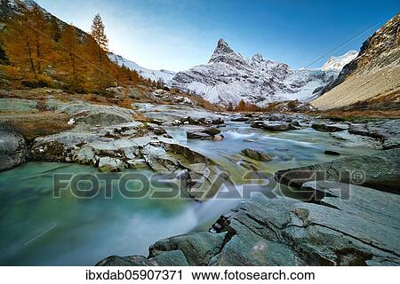 Morning atmosphere at the creek near Ferpècle, behind it snowy Mont Miné, Val d'Hérens, Canton Valais, Switzerland, Europe View Large Photo Image Stock Image - Morning atmosphere at the creek near Ferpècle, behind it snowy Mont Miné, Val d'Hérens, Canton Valais, Switzerland, Europe. Fotosearch
