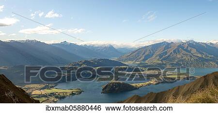 Stock Photograph - Mountain and lake views from Mount Roy, Roys Peak, Lake Wanaka, Southern Alps, Otago, South Island, New Zealand, Oceania. Fotosearch