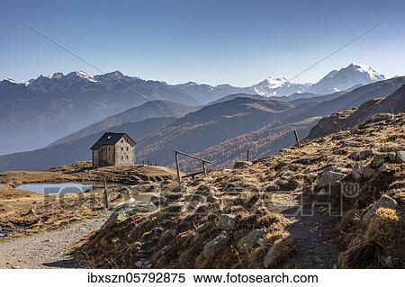 Mountain hut Sesvenna in front of an alpine panorama with Ortler, South Tyrol, Italy, Europe View Large Photo Image Stock Photography - Mountain hut Sesvenna in front of an alpine panorama with Ortler, South Tyrol, Italy, Europe. Fotosearch
