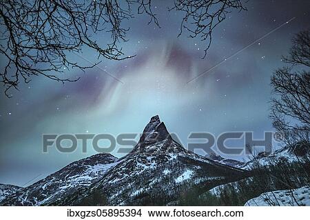 Picture - Mountain peak (Aurora borealis) Stetind, arctic winter landscape, night view, starry sky, northern lights Northern Lights, Stetinden, Nordland, Norway, Europe. Fotosearch