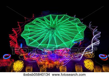 Night shot, dynamic lights, rides, Giegelberg amusement park, Biberach, Baden-Württemberg, Germany, Europe View Large Photo Image Picture - Night shot, dynamic lights, rides, Giegelberg amusement park, Biberach, Baden-Württemberg, Germany, Europe. Fotosearch