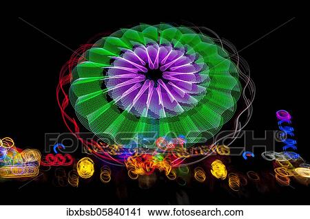 Stock Image - Night shot, dynamic lights, rides, Giegelberg amusement park, Biberach, Baden-Württemberg, Germany, Europe. Fotosearch